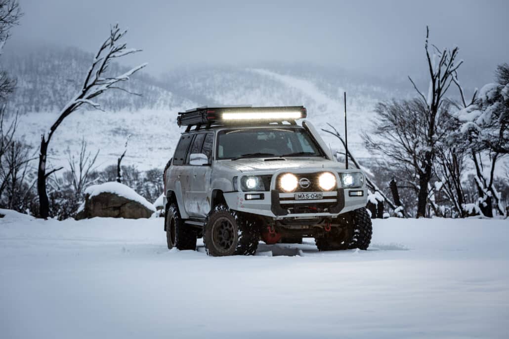 4WD with driving lights in the snow